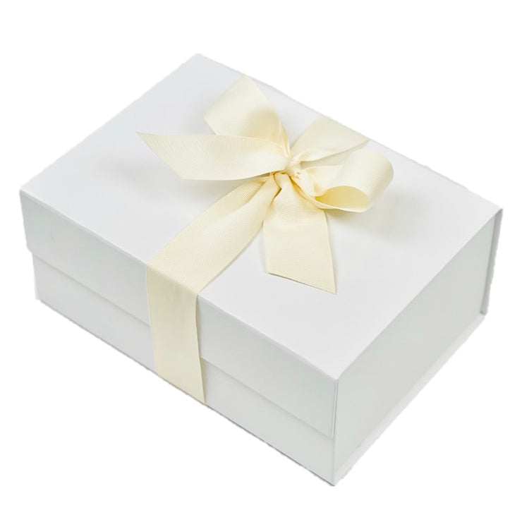 La boîte cadeau avec ruban The White Company